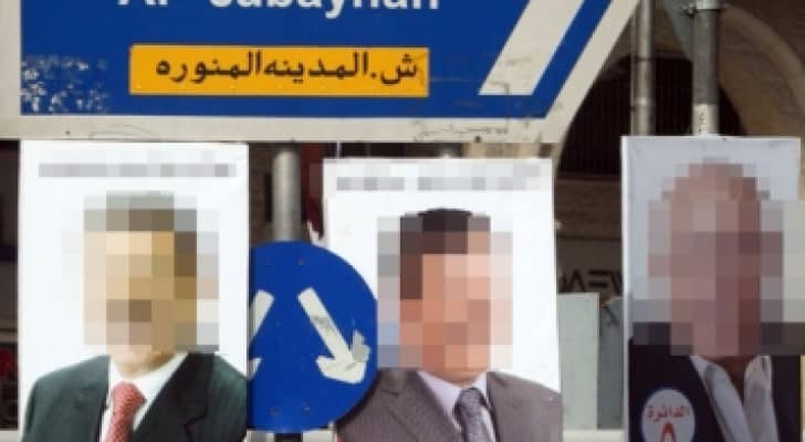 صور ويافطات تتزاحم على الميادين متجاوزة تعليمات الدعاية الانتخابية