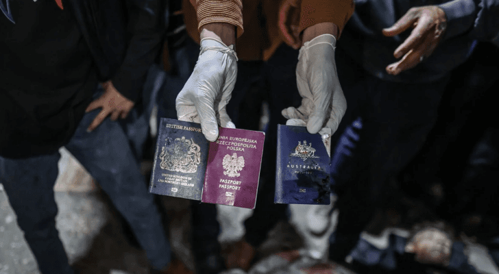 جوازات سفر الفريق الإغاثي بعد استهدافهم من قبل الاحتلال