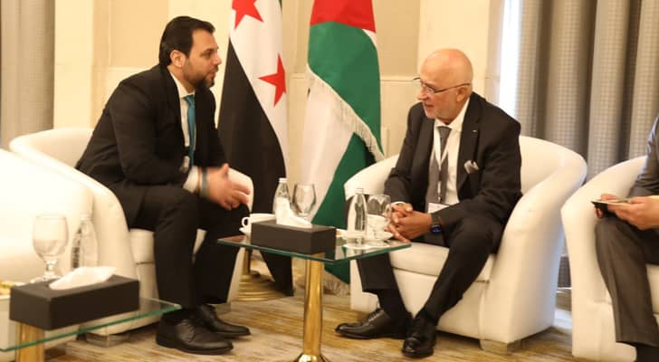 رئيس مجلس مفوضي الهيئة المستقلة للانتخاب موسى المعايطة و رئيس اللجنة العليا لإدارة الانتخابات لمجلس الشعب السوري محمد طه الأحمد